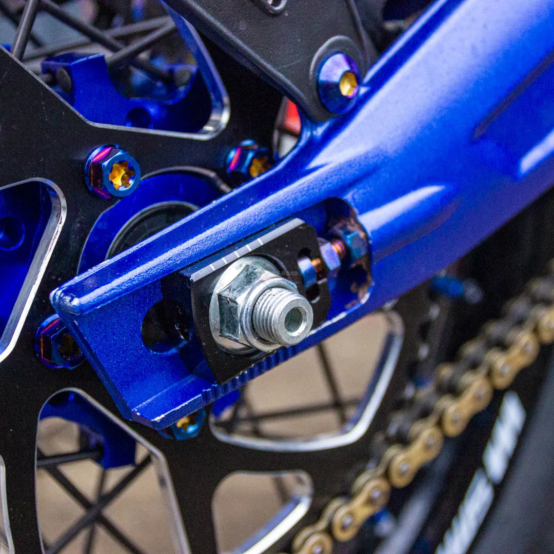 WARP 9 RACING Sur Ron Light Bee Lockdown Axle Blocks/Chain Tensioner - Go Off Road Barnsley