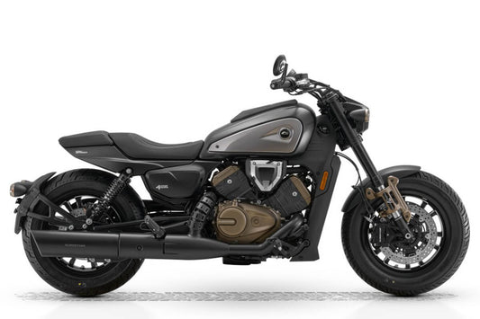 Side view of QJMotor SRV 600 V4 power cruiser in black showing quad exhaust pipes and low-slung stance